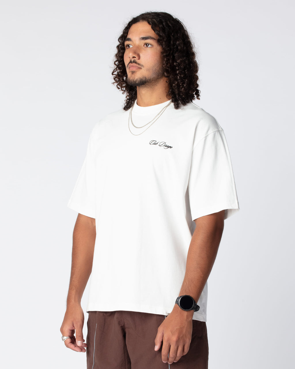 Side view of Ahmed in the Oversized Sun T-Shirt in White Ivory color