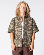 Our bestseller top: The Script Short Sleeve Button Up Shirt in Digital Camo