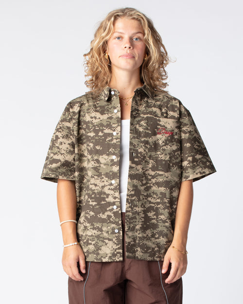 Our bestseller top: The Script Short Sleeve Button Up Shirt in Digital Camo