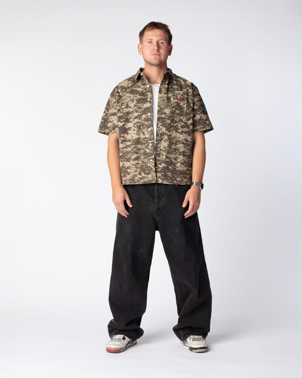 Full front outfit shot of Mathias in our Short Sleeved Script Shirt in the color Digital Camo