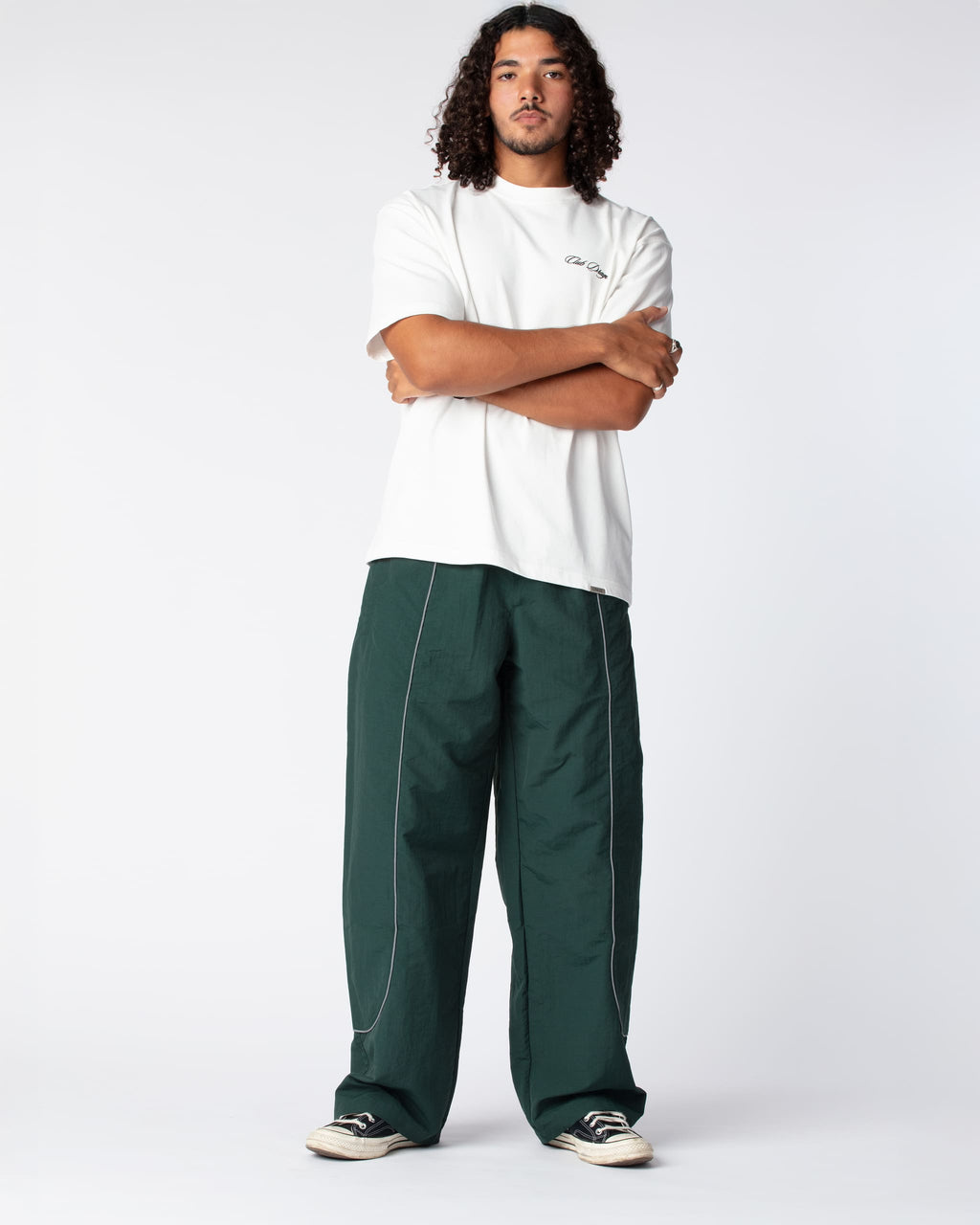 Full outfit shot of Ahmed in the Track Pants Olive, hightlighting the acclaimed wide fit silhoutte
