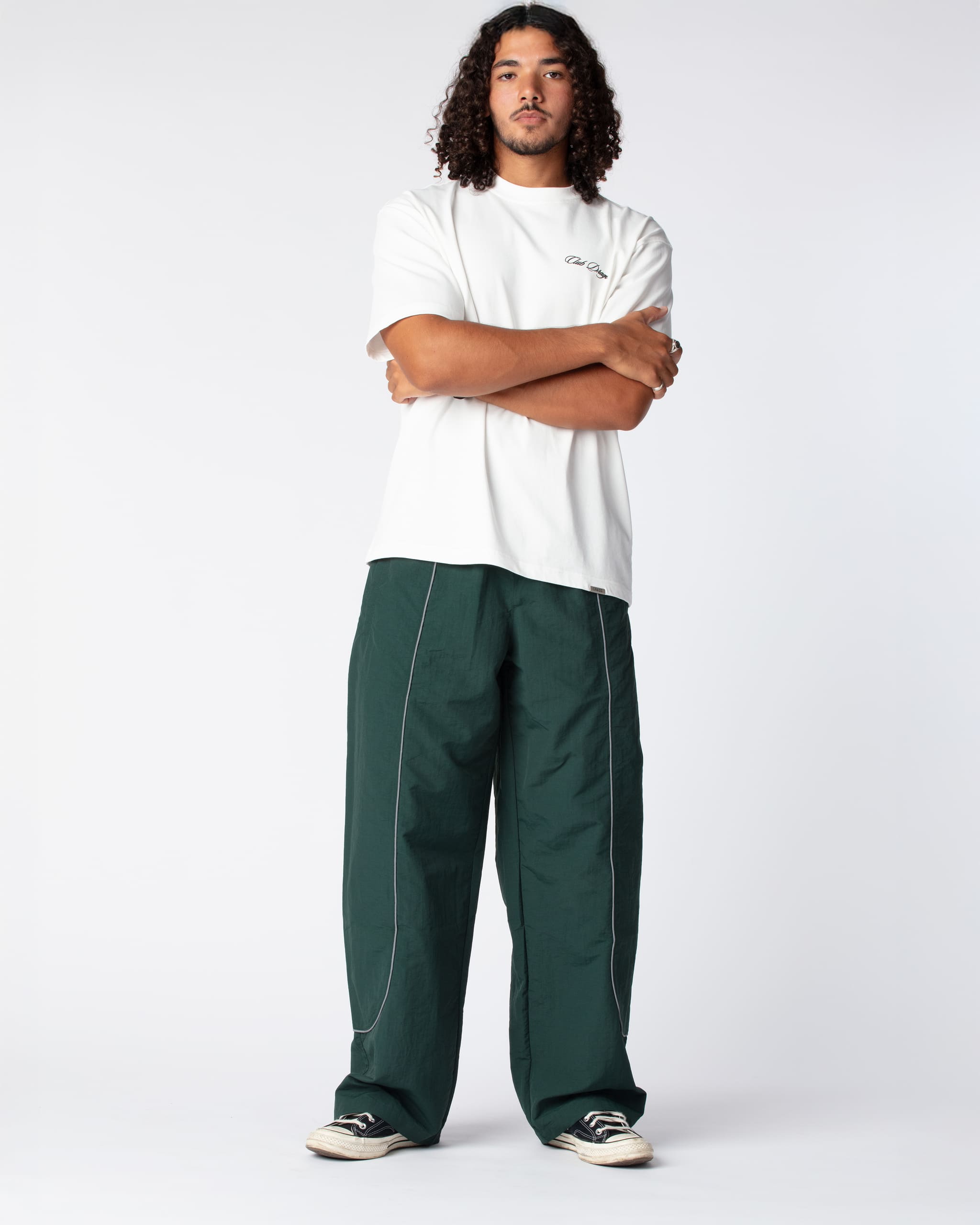Full outfit shot of Ahmed in the Track Pants Olive, hightlighting the acclaimed wide fit silhoutte