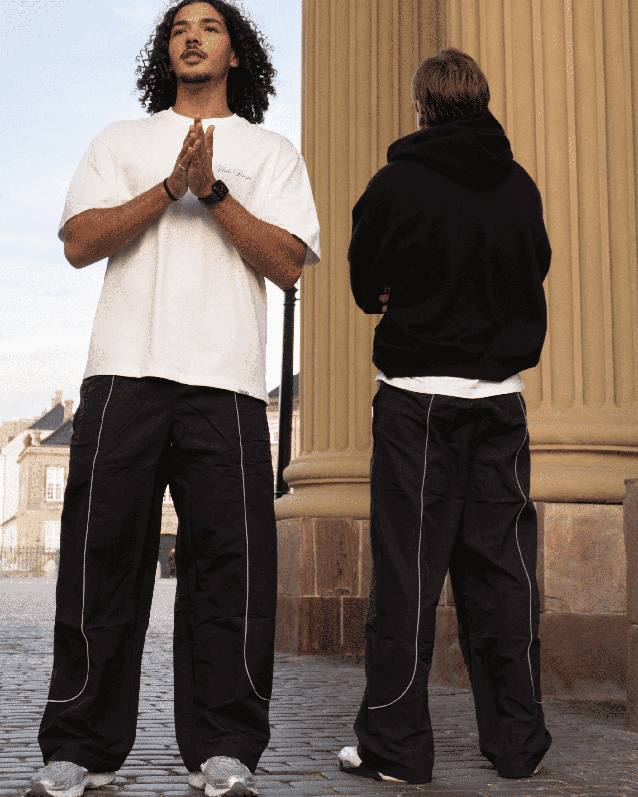 Ahmed and Mathias in our Track Pants Obsidian, shown from the front and back