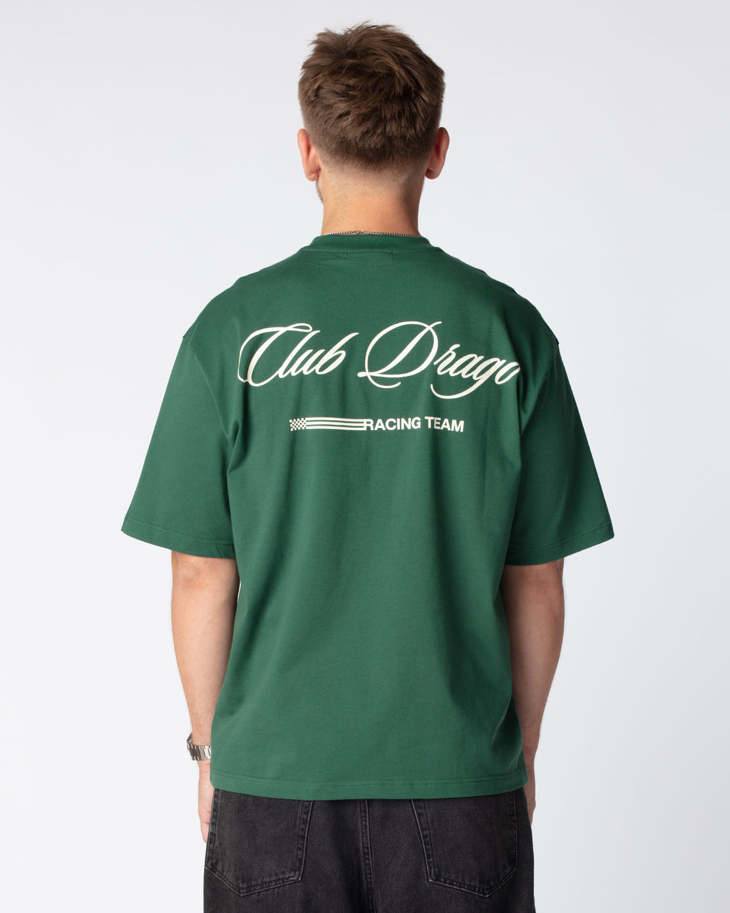 Rear shot of Mathias in our Racing Team T-Shirt in a rich British Racing Green color