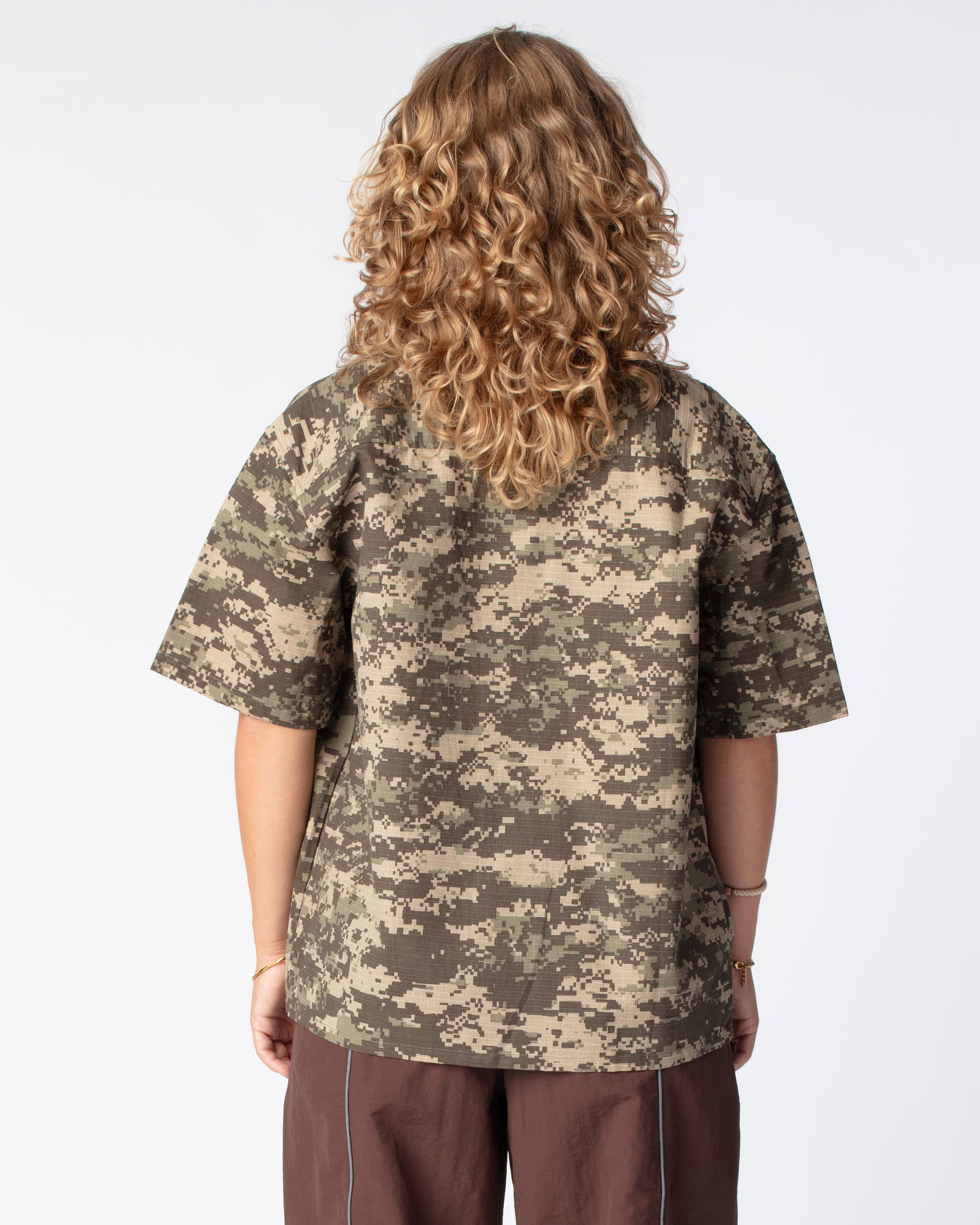 Rear shot highlighting the popular box-fit shape of the DRAGO Short Sleeve Script Shirt