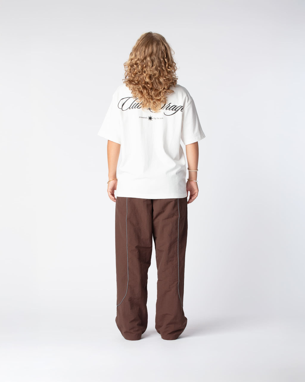 Rear view of Nikoline in our Oversized Sun T-Shirt with a large screenprint on the back