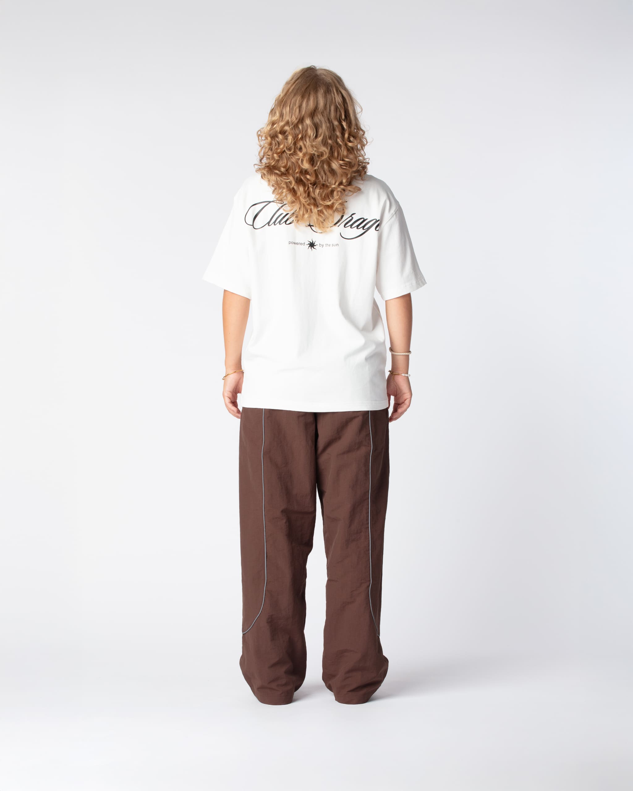 Rear view of Nikoline in our Oversized Sun T-Shirt with a large screenprint on the back