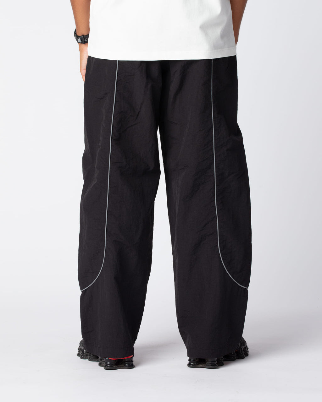 Rear shot showing off the Obsidian Black Track Pants highlighting the premium composition of material and fit