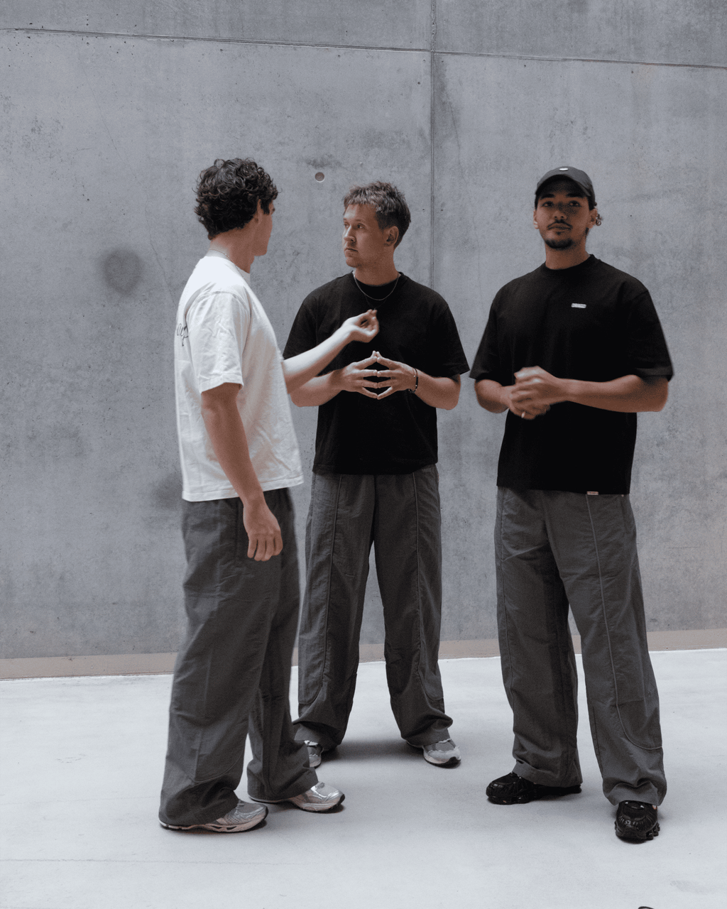 Group shot of Marco, Mathias & Ahmed in DRAGO Track Pants Steel